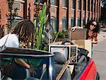 Couple Packing Car Full of Belongings