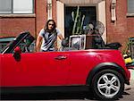 Portrait of Man with Car Full of Belongings