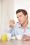 Man Eating Breakfast Cereal