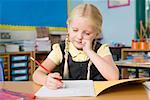 Girl writing in book