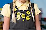 Stickers on a girls pinafore