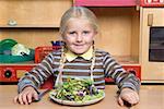 Girl with a plate of salad