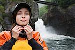 Female kayaker adjusting helmet