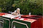 Woman Reading on Boat