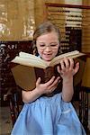 Girl with Large Book