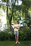 Portrait of Girl with Dog in Garden