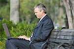 Businessman Using Laptop Outdoors