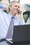 Businessman Using Laptop Outdoors