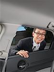 Businessman Looking in Car
