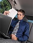 Businessman Working in Car