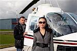 Businesswoman and Pilot by Helicopter