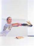 Woman Flipping Pancake