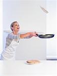 Woman Flipping Pancake