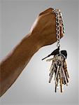 Man holding bunch of keys on a chain