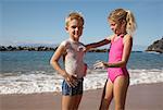 Children Applying Sunscreen