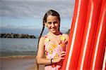 Portrait of Girl Holding Inflatable Raft