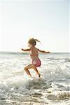 Little Girl Playing on the Beach