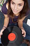 Young Woman Holding Record