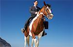 Businessman Riding Horse