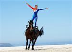 Circus Performer Standing on Horse