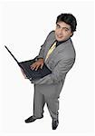 High angle view of a businessman holding a laptop