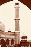Rear view of a group of people in the courtyard of a mosque, Jama Masjid, New Delhi, India