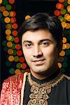 Portrait of a young man wearing traditional Indian clothing