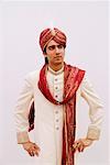 Groom wearing a traditional wedding outfit