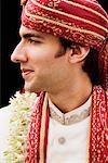 Close-up of a groom in a traditional wedding dress