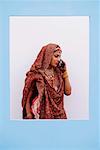 Bride talking on a mobile phone