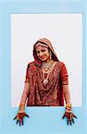 Portrait of a bride in a traditional wedding dress smiling