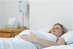 Pregnant Woman Lying on Bed