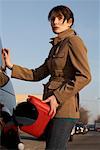 Woman Filling Gas Tank