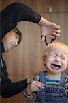 Mother Cutting Son's Hair