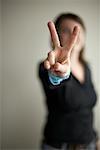 Woman Making Peace Sign