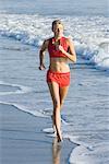 Woman Running at Beach
