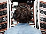 Man Looking at Stereo Equipment