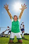 Soccer Player Cheering After Scoring Goal