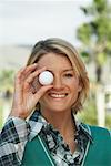 Portrait of Woman Holding Golf Ball