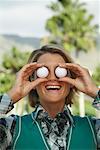 Portrait of Woman Holding Golf Balls