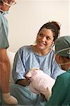 Woman Holding Newborn