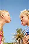 Siblings Sticking out Tongues at Each Other