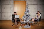 Couple at Home with Christmas Tree