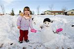 Little Girl With Snowman