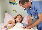 Doctor Examining Child in Hospital