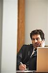 Businessman Using Telephone