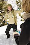 Women Putting Chistmas Lights on Tree