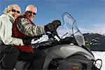 Couple Snowmobiling