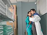 Doctor and Nurse Kissing in Supply Room