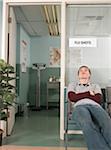 Teenaged Boy Waiting in Doctor's Office